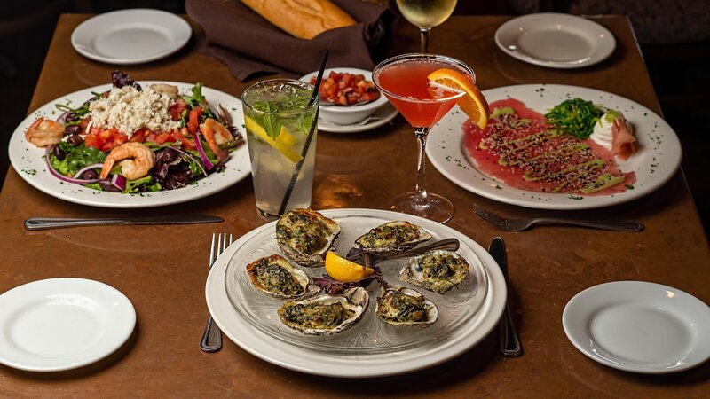 Three appetizers with focus on oysters appetizer